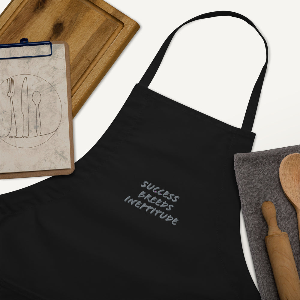 "Success Breeds Ineptitude" Embroidered Apron
