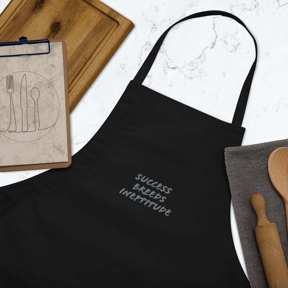 "Success Breeds Ineptitude" Embroidered Apron